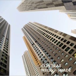 Quatre immeubles type gratte-ciel, vue plongeante pour illustrer le contrat Micro-Trade